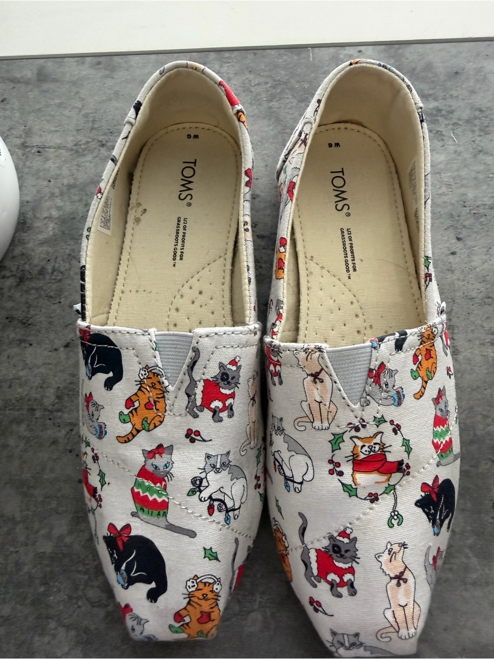 TOMS Holiday Cat Canvas Slip-Ons in Cream with Red & Green Accents